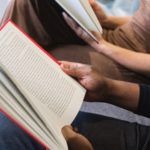 people reading together for book club
